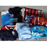 A collection of Manchester City Football Club replica shirts, polo shirts and similar,