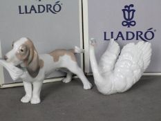 Lladro - Two boxed figurines comprising Morning Delivery # 6398 and White Swan # 6175