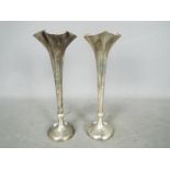 A pair of Edward VII hallmarked silver bud vases of tapered, quatrefoil form, London assay 1907,