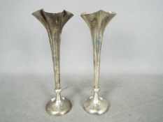 A pair of Edward VII hallmarked silver bud vases of tapered, quatrefoil form, London assay 1907,