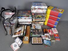 Lot to include CD's, DVD's, playing cards,