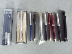 A collection of pens, predominantly by Parker.