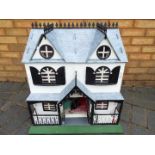 Three scratch built wooden dolls houses. Click on photographs to view each house.
