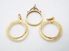 Three 9ct gold sovereign pendant mounts, approximately 5.6 grams all in.