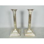 A pair of Mappin & Webb Prince's Plate, Corinthian column candlesticks, approximately 30 cm (h).