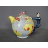 A vintage Empire Ware teapot in the form of a globe depicting the British Empire,