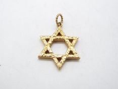 A 9ct yellow gold Star of David pendant, 2.5 cm x 25. cm, approximately 4.9 grams all in.