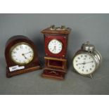 A Bayard, mahogany cased, 8 day mantel clock, approximately 15.5 cm (h) and two other clocks.