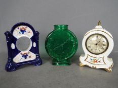 A Smiths Empire Alarmette pottery cased alarm clock,