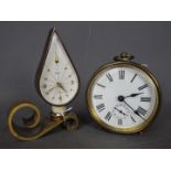 A brass cylindrical desk clock, the movement marked SFRA,