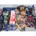 A collection of gentleman's neckties, silk and other and a silk and wool scarf.