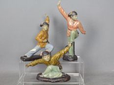 Three Shiwan figurines depicting female martial artists,