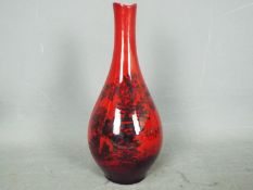 Royal Doulton - a Royal Doulton Flambe Woodcut vase,