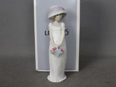 Lladro - A boxed 2004 Events Creation figurine entitled Little Lady, # 8022,