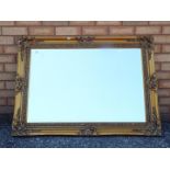 A large bevel edged mirror, approximately 80 cm x 110 cm.
