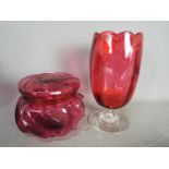 A Cranberry Glass vase 21 cm and an ornate lidded pot 12 cm