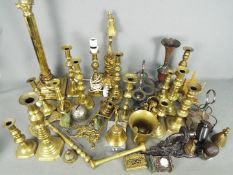 A quantity of metalware, predominantly brass.