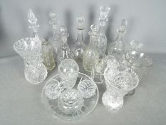 A quantity of glassware to include decanters, vases and similar.