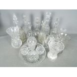 A quantity of glassware to include decanters, vases and similar.