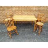 A modern dining table 76 cm x 140 cm x 80 cm with three pine breakfast stool and one pine dining