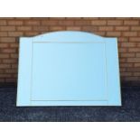 A large wall mirror measuring approximately 100 cm x 130 cm.