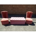 Two upholstered bedroom chairs and a matching linen chest.