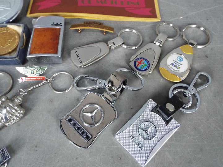 Automobilia - A collection of car badges, motoring related keyrings and pin badges, - Image 4 of 6