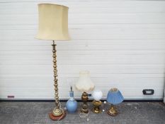 A brass standard lamp, three brass table