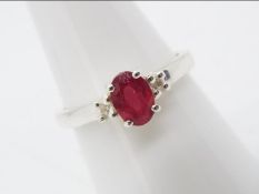 A size P to Q Malagasy Ruby & White Zircon set in a silver ring,