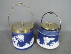 Two Adams jasperware biscuit barrels, each decorated with a hunting scene.