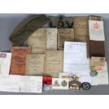 A collection of military items to include a World War Two (WW2 / WWII) defence medal with slip in