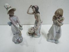 Lladro Three lady figures. Blue factory marks and impressed numbers.