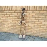 A wooden novelty skeleton,