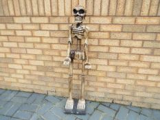 A wooden novelty skeleton,