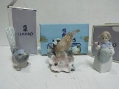 Lladro - Three figures(boxed). Blue factory marks and impressed numbers. Tallest is 13cm high.