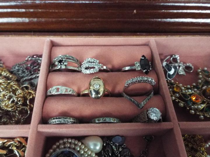 A jewellery box containing a quantity of costume jewellery including rings stamped 'Silver', - Image 4 of 7