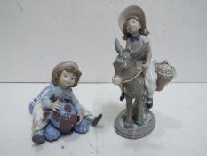 Lladro Two Child figures. Blue factory marks and impressed numbers. Tallest 20cm high.