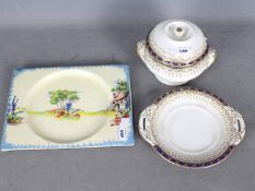 A Royal Staffordshire The Biarritz plate decorated with a cottage landscape scene with blue rim and