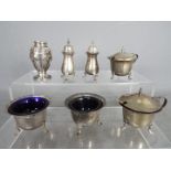 A collection of hallmarked silver cruets, salts and similar, various assay marks,