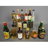 Eighteen bottles of whisky and other alcohol miniatures to include Glenfiddich over 8 y/o 70° proof,