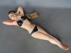 A Combex novelty hot water bottle in the form of Jayne Mansfield in a black bikini,