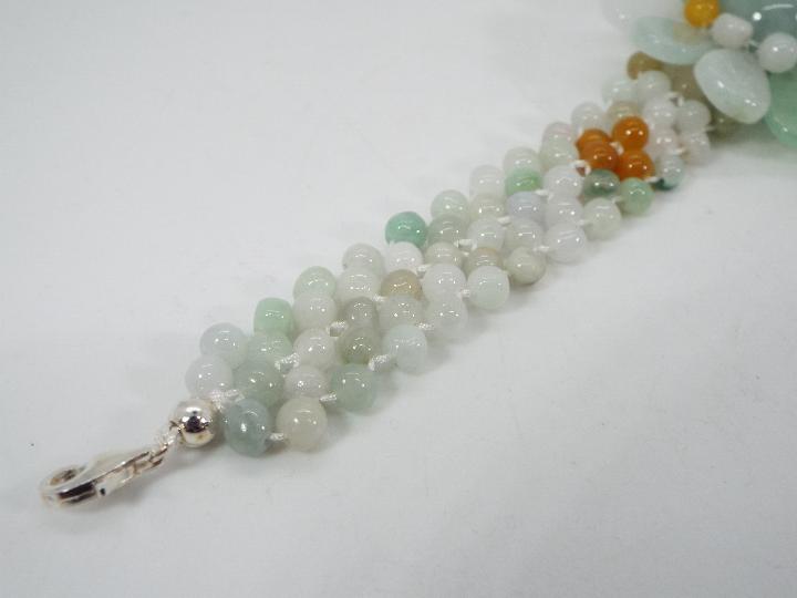 A 121 ct Burmese Natural Jadeite 'Colours of Paradise' flower bracelet set with silver, - Image 3 of 6