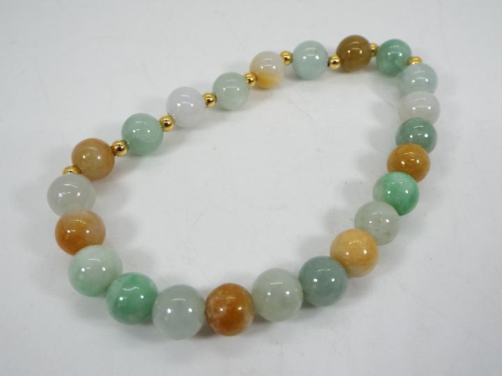 An 85 ct Natural Jadeite Gold Tone bracelet with gold plated sterling silver,