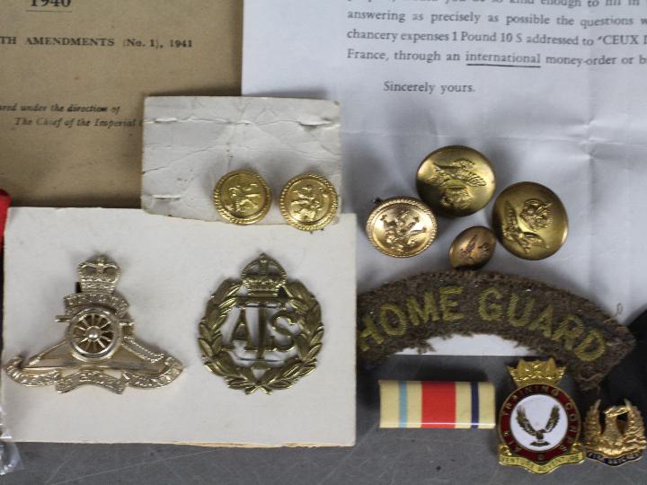 A collection of military items to include a World War Two (WW2 / WWII) defence medal with slip in - Image 3 of 8