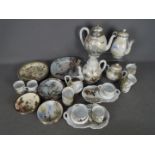 A collection of tea wares, predominantly decorated with red crowned crane.