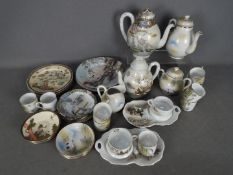 A collection of tea wares, predominantly decorated with red crowned crane.