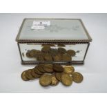 A mirror box of threepence pieces.