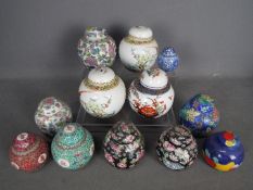 A group of twelve ginger jars and covers,