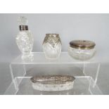 A collection of silver mounted dressing table items and similar, various assay and date marks.