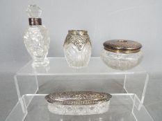 A collection of silver mounted dressing table items and similar, various assay and date marks.